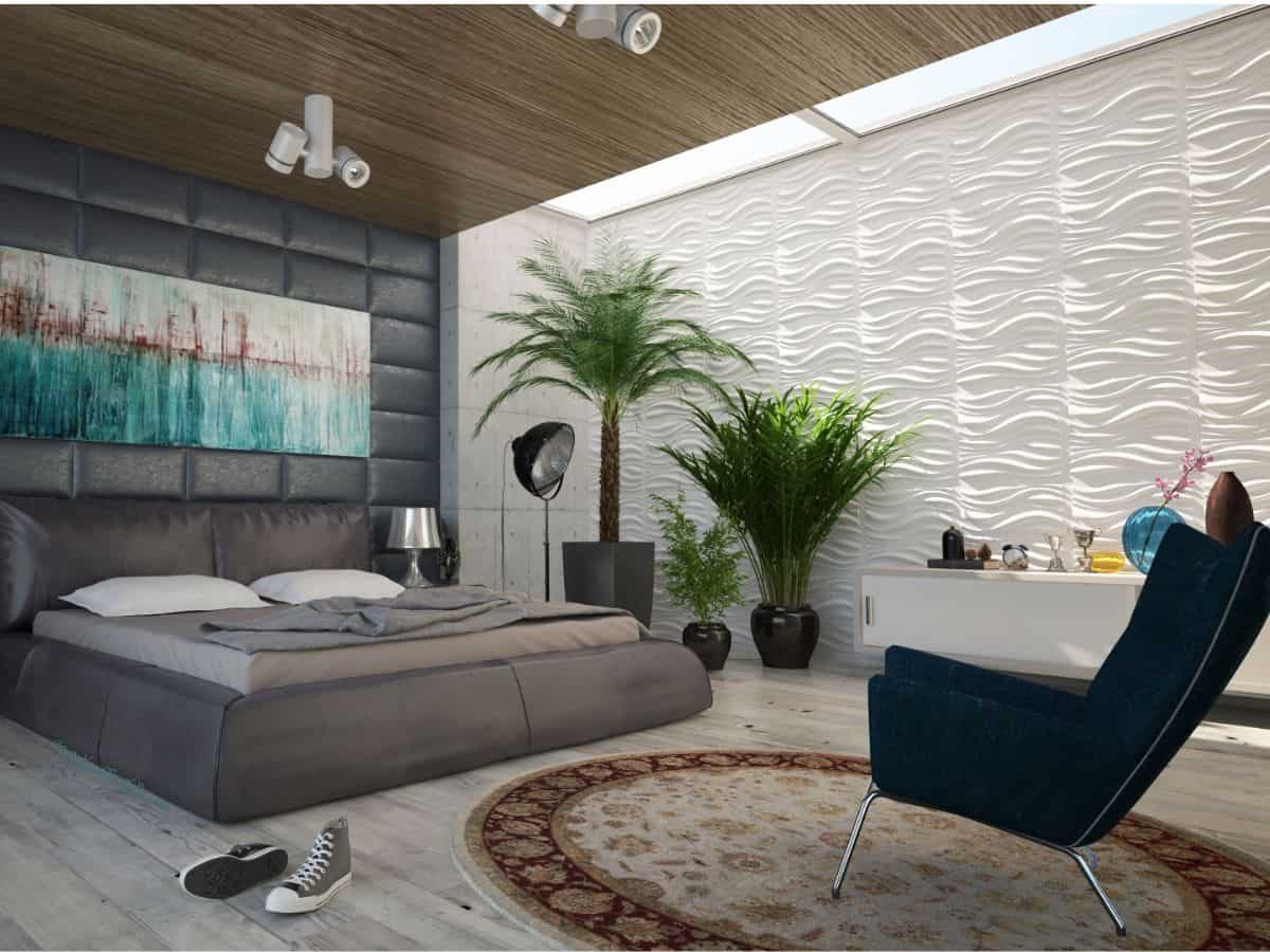 Modern bedroom in greys and browns with bright turquoise painting hanging above bed