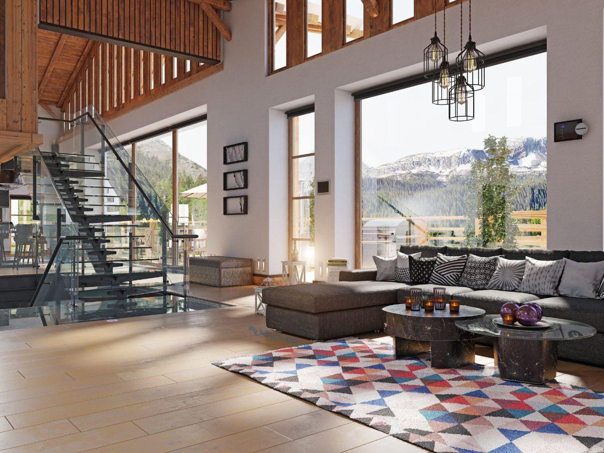 Open living room with grey sectional and colorful rug